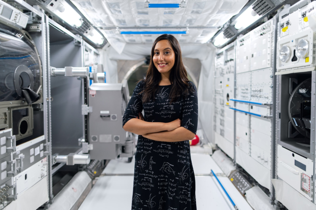 Female space operations engineer in space tunnel